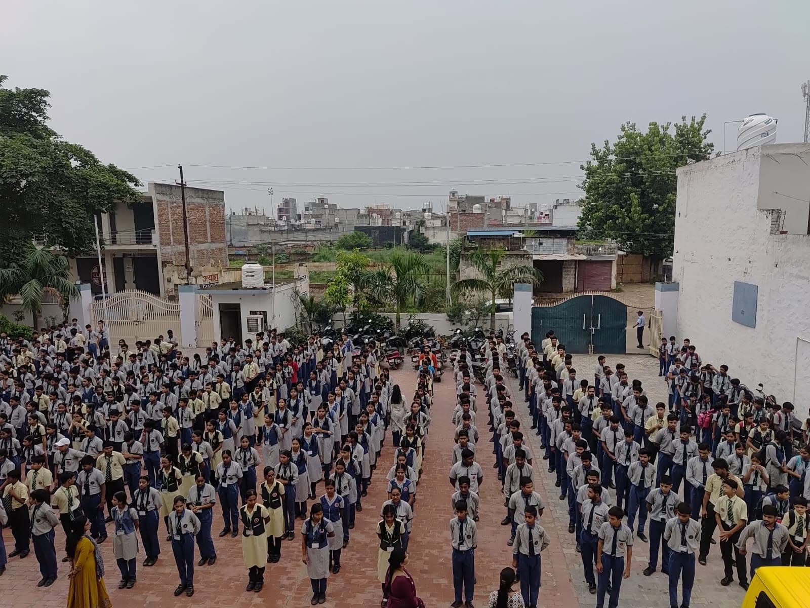 Students assembled in orderly rows in the courtyard of NPS International School, Prime City 3 Campus
